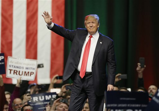 Republican presidential candidate businessman Donald Trump acknowledges the crowd before addressing supporters at a campaign rally in Grand Rapids Mich. Months of intense focus on the Republican race and front-runner Trump