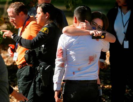 A couple embraces following a shooting that killed multiple people at a social services facility Wednesday Dec. 2 2015 in San Bernardino Calif