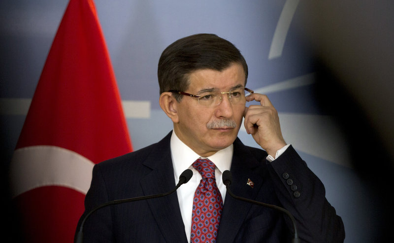 Turkish Prime Minister Ahmet Davutoglu speaks to the media during a visit to northern Cyprus