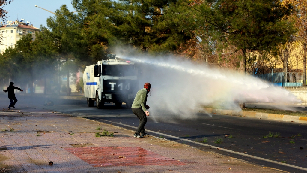 Rot police use water cannon and teargas to break up a protest in Diyarbakir Turkey Monday Dec. 14 2015. Police on Monday clashed with a group of Kurds following a protest by some 5,000 people denouncing a days long curfew imposed by the government