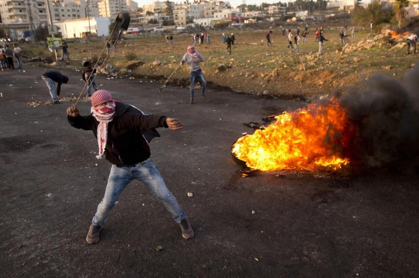 Suha and Hussein Abu Khdeir centre parents of Mohammed Abu Khdeir after the reading of the verdict in his killing on Monday. Hussein however wasn't very convinced of the verdict “This is a lie,” he told Israeli Army Radio. “I am afraid that