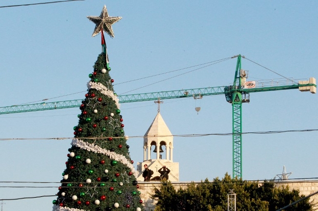 IN PHOTOS: Tens of Thousands Flock to Israel and West Bank for Christmas