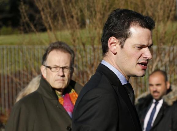 Head of the Department of Security of Geneva Pierre Maudet and United Nations Director General Michael Moeller meet outside the U.N. European headquarters in Geneva Switzerland