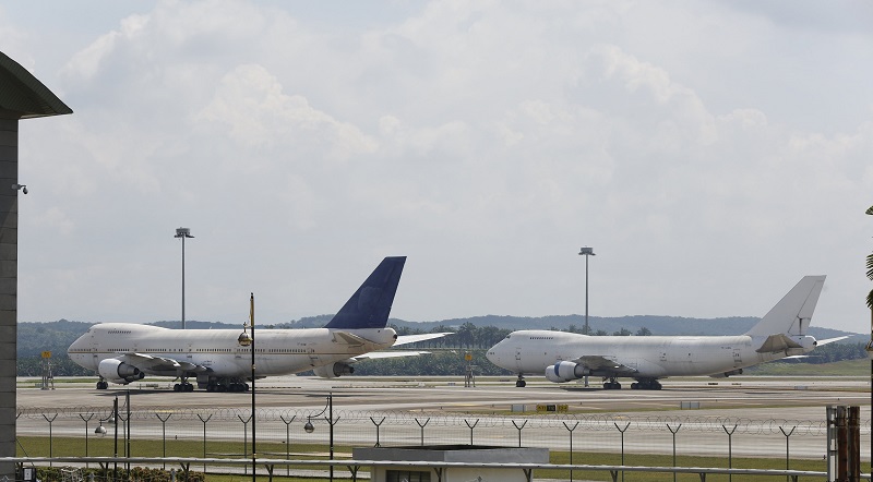 Two of three abandoned Boeing 747 planes are parked on the tarmac at Kuala Lumpur International Airport in Sepang. – Reuters pic