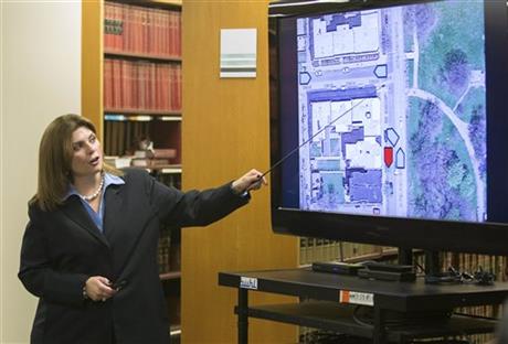 Cook County Assistant State's Attorney Lynn Mc Carthy shows a map at a news conference Monday Dec. 7 2015 in Chicago detailing evidence before showing a dashcam video of the Oct. 12 2014 shooting death of 25-year-old Ronald Johnson by a Chicago police