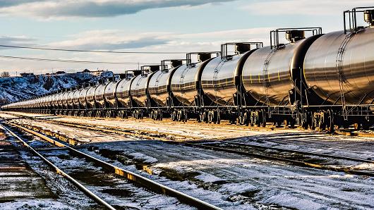 An oil train passes through a Montana railyard from Williston North Dakota