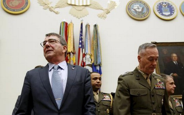 US Defence Secretary Ash Carter and Joint Chiefs Chairman Marine Corps Gen. Joseph Dunford Jr arrive to testify before a House Armed Services Committee hearing on'US Strategy for Syria and Iraq and its Implications for the Region in Washington Dec