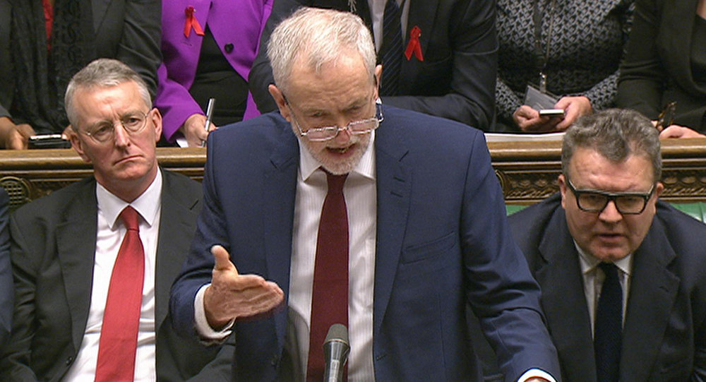 Opposition Labour Party leader Jeremy Corbyn center stands as he makes a speech to lawmakers inside the House of Commons in London during a debate on launching airstrikes against Islamic State extremists inside Syria Wednesday Dec. 2 2015