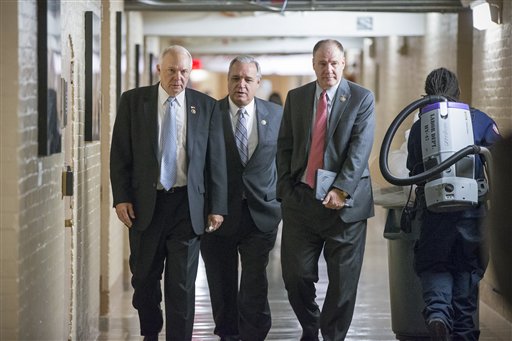 Rep. John Kline R-Minn. chairman of the House Education Committee left House Veterans&#039 Affairs Committee Chairman Jeff Miller R-Fla. center and Rep. Trent Kelly R-Miss. right walk through a basement corridor at the Capitol as House Republic