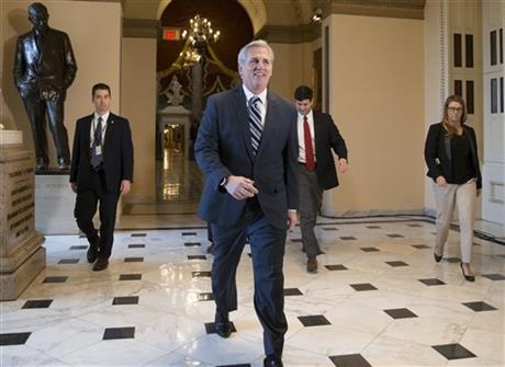 House Majority Leader Kevin McCarthy R-California smiles as he walks to the House chamber at the Capitol in Washington on Friday Dec. 18 2015. The House on Friday easily passed a $1.14 trillion spending bill to fund the government through next Septemb