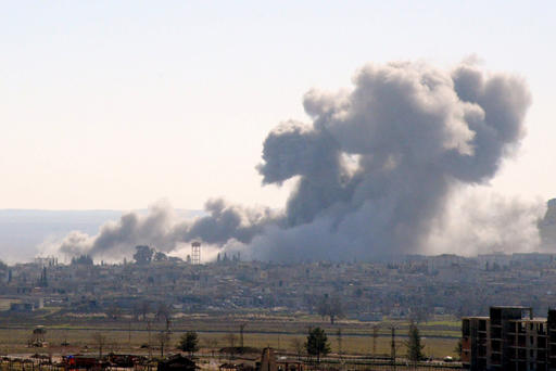 Smoke rising from the Syrian border town of Kobani following the US-led coalition airstrikes against the Islamic State targets near Mursitpinar border crossing on Jan. 23 2015 in Suruc Turkey