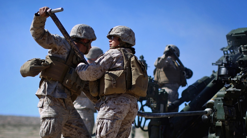 Pentagon chief Ash Carter is expected to announce that women can now serve in frontline combat posts. Here Carolina Ortiz moves away from a 155 mm artillery piece after loading it during a live-fire exercise at the Marine base in Twentynine Palms Calif