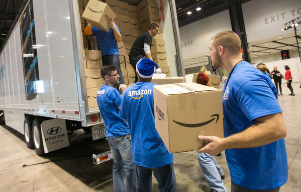 In Chicago, Amazon employees pack 2,000 care packages to send to soldiers abroad during the holidays. PETER WYNN THOMPSON  AP