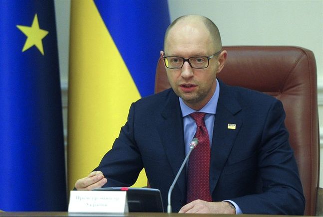 Ukrainian Prime Minister Arseniy Yatsenyuk speaks during a cabinet meeting in Kiev Ukraine Friday Dec. 18 2015 Yatsenyuk said on Friday that his country won't repay a $3 billion debt owed to Russia by this weekend after Moscow's refusal to accept rep