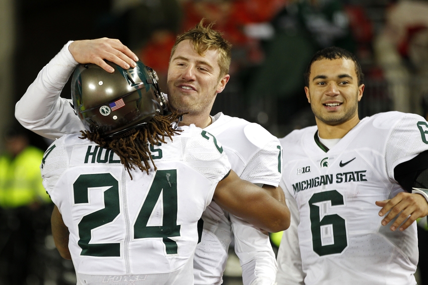 Nov 21 2015 Columbus OH USA Michigan State Spartans quarterback Connor Cook celebrates with Spartans running back Gerald Holmes and Spartans quarterback Damion Terry after their game against the Ohio State Buckeyes at Ohio Stadium. The