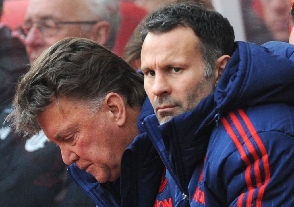 Manchester United manager Louis van Gaal left and assistant manager Ryan Giggs watches the English Premier League soccer match between Stoke City and Manchester United at the Britannia Stadium Stoke on Trent England Saturday