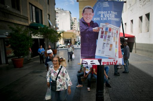 Get ready to vote Pedestrians walk near a poster that shows Venezuela's late President Hugo Chavez calling to vote for pro-government parties in Caracas Venezuela Saturday. As Venezuelans get ready to vote on Dec. 6 in congressional elections polls