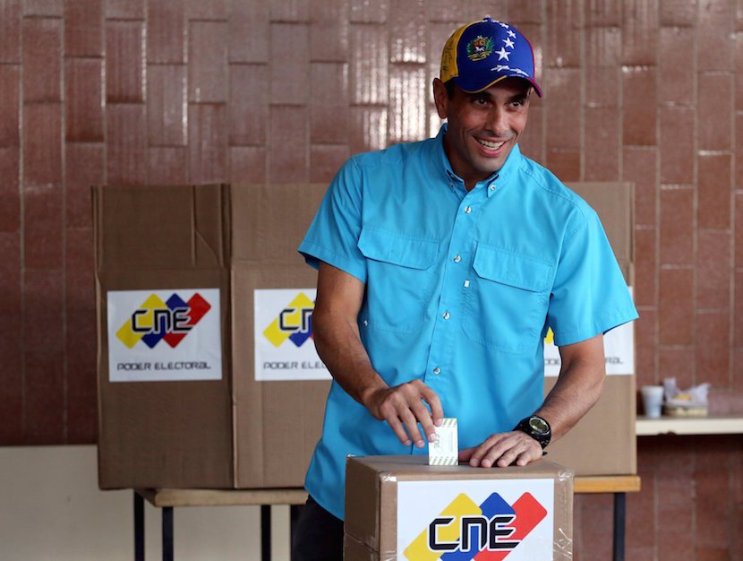 Venezuelan opposition leader Henrique Capriles casts his vote at a polling station during a legislative election in Caracas