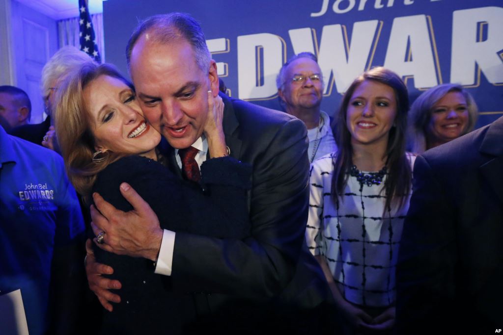 Louisiana Gov.-elect John Bel Edwards hugs his wife Donna Edwards as he arrives to greet supporters at his election night watch party in New Orleans Nov. 21 2015