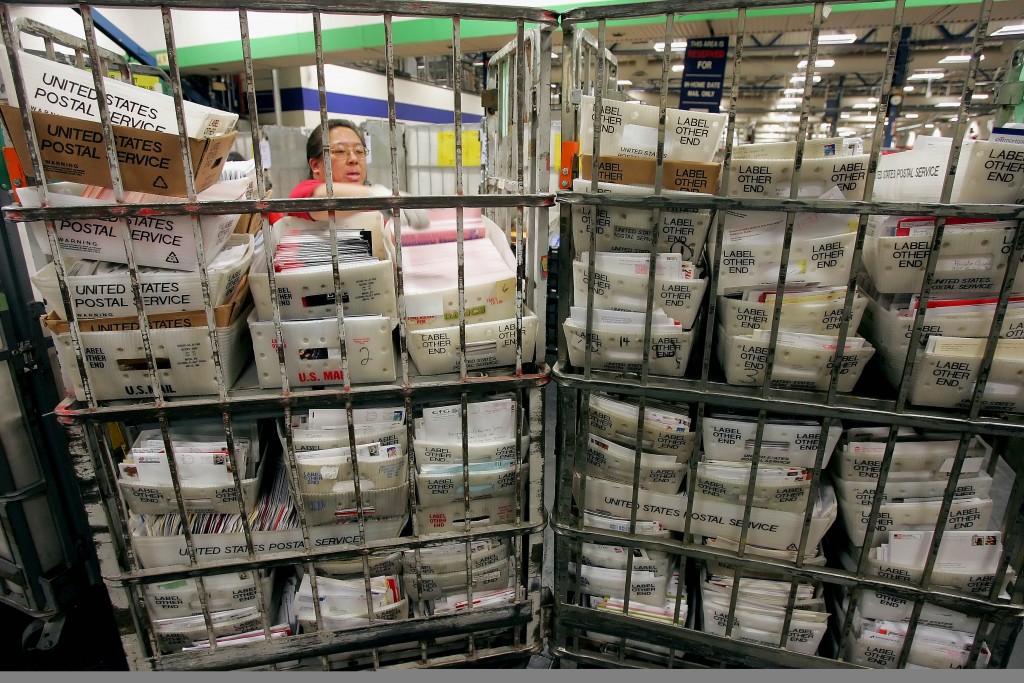 Mail handler Rolanda Ramos sorts through mail at the United States Postal Service Processing and Distribution Center in San Francisco Wednesday Dec. 21 2005. Today is the busiest delivery day of the year for the postal service according to Jim Larkin