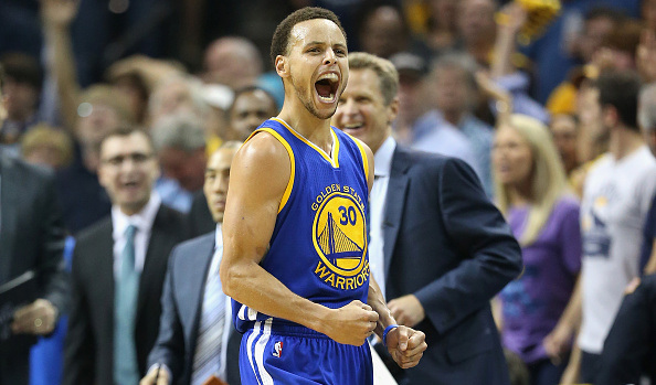 MEMPHIS TN- MAY 15 Stephen Curry #30 of the Golden State Warriors celebrates after making a basket to end the third quarter against the Memphis Grizzlies during Game six of the Western Conference Semifinals of the 2015 NBA Playoffs at FedExForum on M