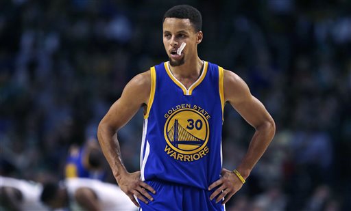 Golden State Warriors guard Stephen Curry waits for play to resume during the first quarter of an NBA basketball game against the Boston Celtics in Boston Friday Dec. 11 2015