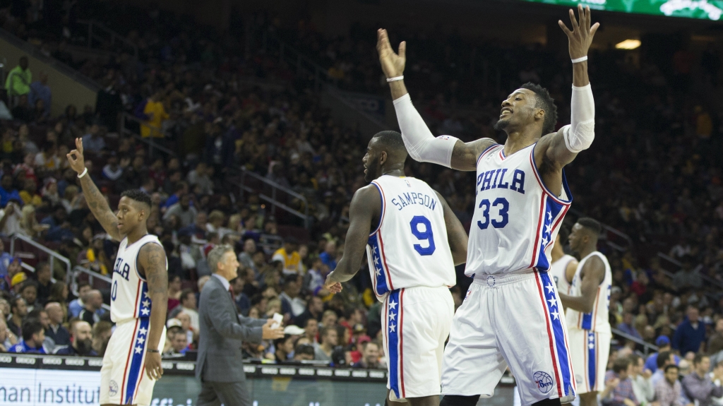 PHILADELPHIA PA- DECEMBER 1 Isaiah Canaan #0 Ja Karr Sampson #9 and Robert Covington #33 of the Philadelphia 76ers react after a timeout in the game against the Los Angeles Lakers