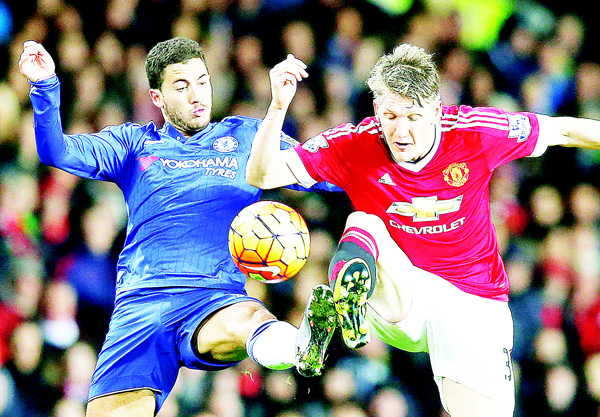 Manchester United’s Bastian Schweinsteiger, is challenged by Chelsea’s Eden Hazard during the English Premier League soccer match between Manchester United and Chelsea at Old Trafford Stadium Manchester England on Dec 28