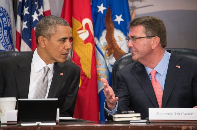 US President Barack Obama speaks with US Secretary of Defense Ashton Carter during a National Security Council meeting on the campaign against ISIL at