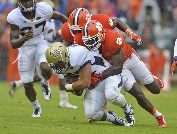 Clemson's Jayron Kearse center and Richard Yeargin tackle Georgia Tech's Mikell Lands Davis during the first half of an NCAA college football game in Clemson S.C. No one pushes No. 1 Clemsonâ€™s def