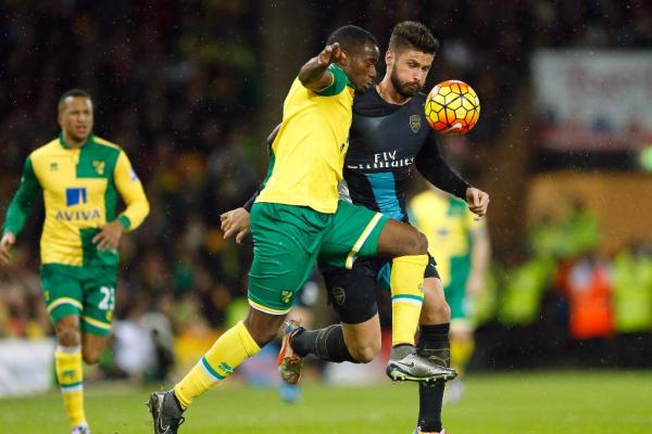 Norwich's Sebastien Bassong and Arsenal's Olivier Giroud in action during Norwich City v Arsenal Barclays Premier League at Carrow Road on29/11/15 Reuters  Andrew Boyers