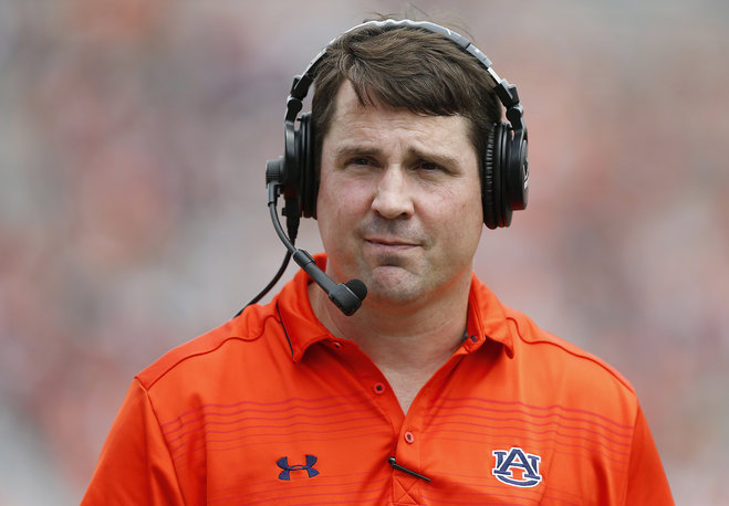 Auburn defensive coordinator Will Muschamp walks around the football field in the first quarter of their spring NCAA college football game in Auburn Ala. A person with direct knowledge of the decision says Musch