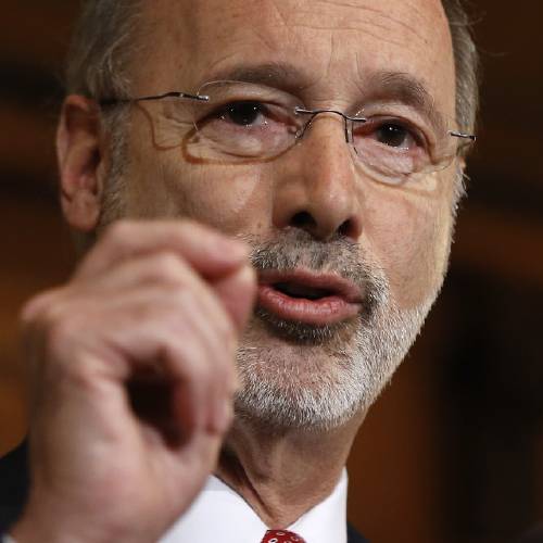 Tom Wolf speaks with members of the media Tuesday Dec. 29 2015 at the state Capitol in Harrisburg Pa. Wolf says he is rejecting parts of a $30.3 billion state budget plan that's already a record six months overdue but