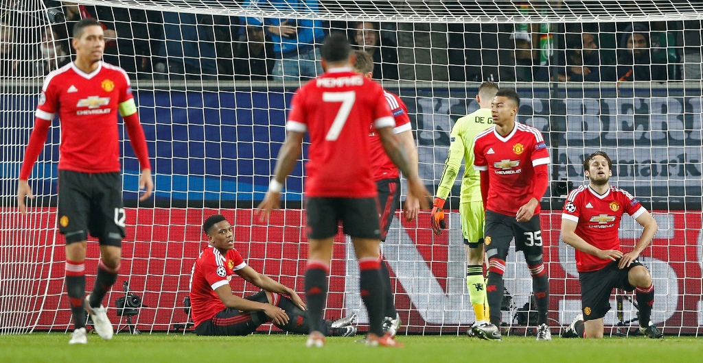 Manchester United players had no answer to VfL Wolfsburg as they lost in Germany and went down to third place in the table. – Reuters pic