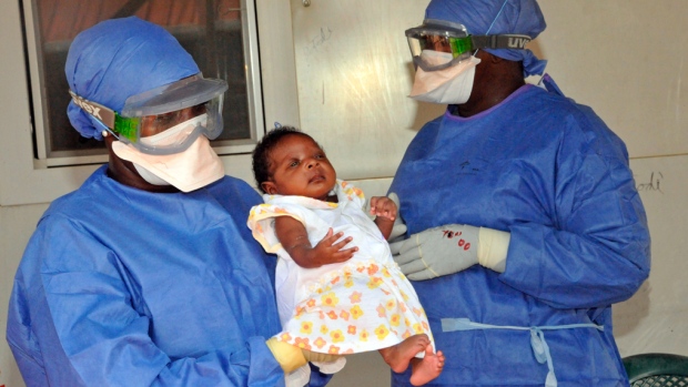 Medical workers present Noubia, the last known survivor to contract Ebola in Guinea during her release from a Doctors Without Borders treatment centre in Conakry last month