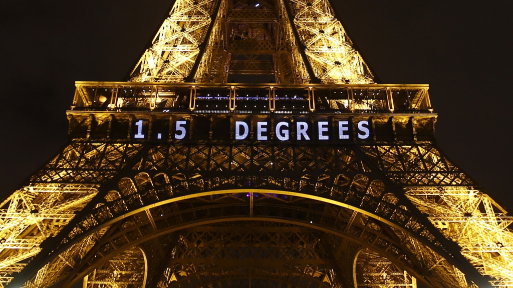 One target for limiting global warming —'1.5 DEGREES — is projected on the Eiffel Tower on Friday as part of the United Nations Climate Change Conference in Paris