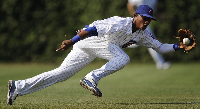 Chicago Cubs shortstop Starlin Castro fields an infield single by Atlanta Braves Jason Heyward during the third inning of a baseball game in Chicago. The Cubs traded Castro to the New York Yankees in exchange for