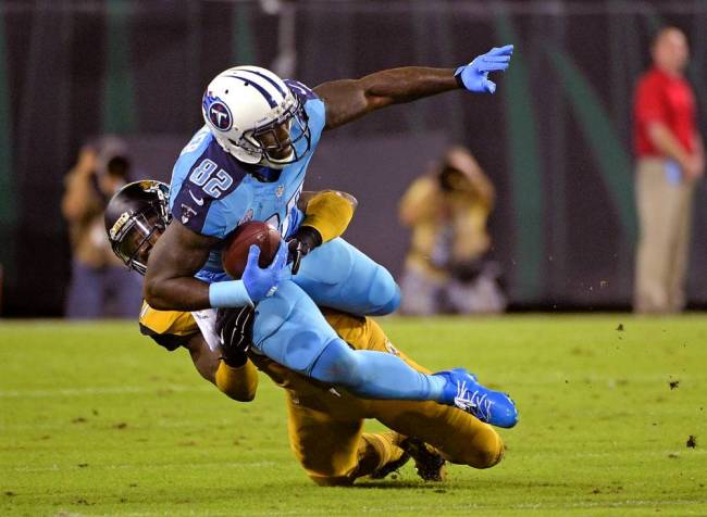 Titans tight end Delanie Walker reaching for yardage after making a catch Thursday night against the Jaguars