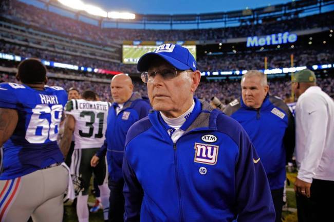 Tom Coughlin leaves the field Sunday after the Giants&#39 crushing overtime loss to the Jets