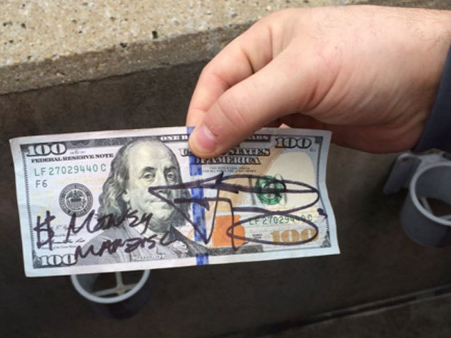 Johnny Manziel signs $100 bill