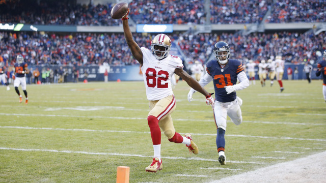 CHICAGO IL- DECEMBER 6 Torrey Smith #82 of the San Francisco 49ers runs into the end zone with a 71-yard touchdown reception against the Chicago Bears to win the game in overtime at Soldier Field