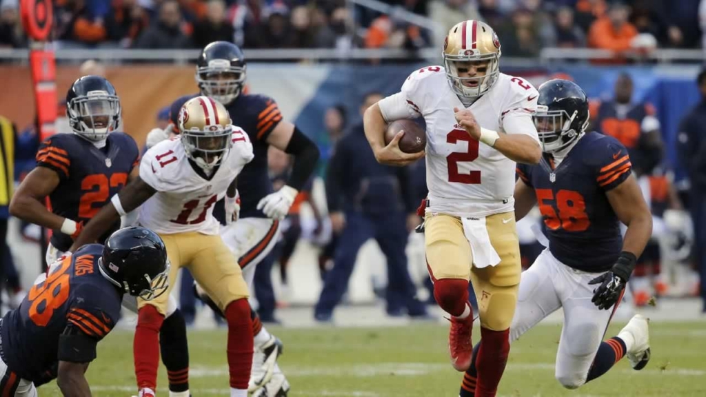 San Francisco 49ers quarterback Blaine Gabbert runs to the end zone for a touchdown during the second half of a game against the Chicago Bears Sunday Dec. 6 2015 in Chicago