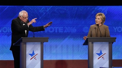 Bernie Sanders left and Hillary Clinton speak during an exchange during the Democratic presidential primary debate Saturday Dec. 19 2015 at Saint Anselm College in Manchester N.H