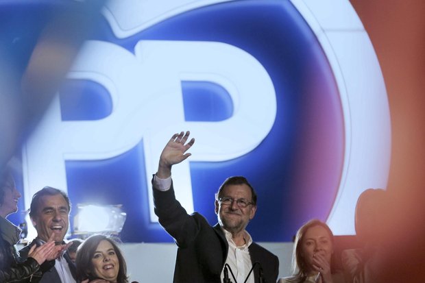 Mariano Rajoy greets his supporters- but the poll results may mean a leftwing coalition for Spain
AP