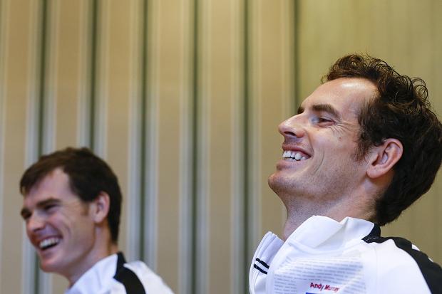 Britain’s Andy Murray and his brother Jamie smile during an interview