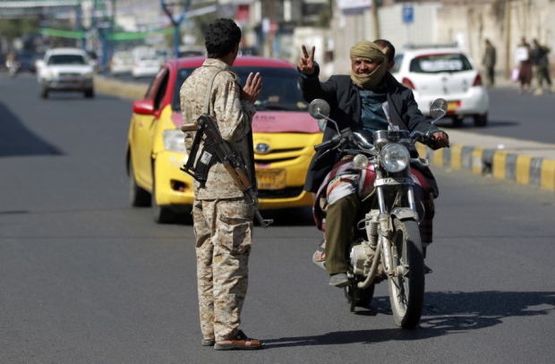 A Yemeni member of Iran-backed Shiite Houthi group mans a checkpoint on a street on Thursday