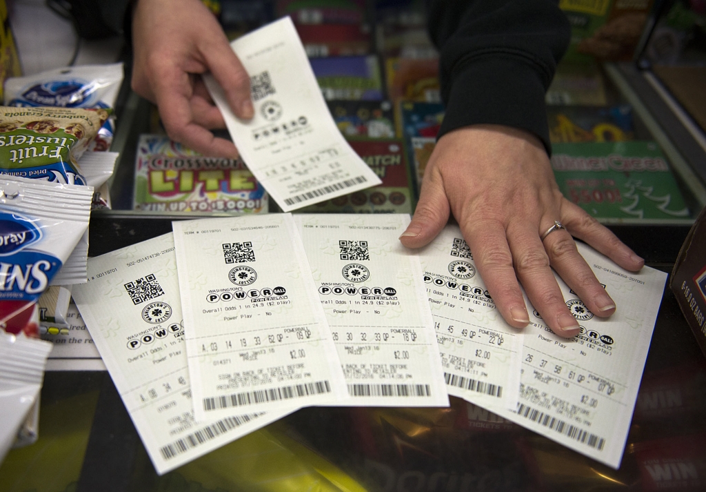 A customer purchases Powerball lottery tickets at Talbert's Ice & Beverage Service in Bethesda Maryland