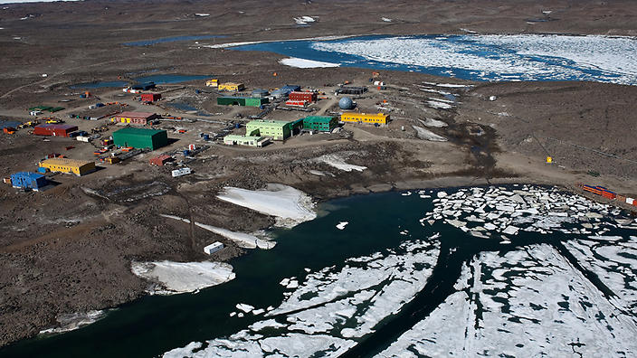 A helicopter pilot remains in a critical condition after falling into a crevasse in Antarctica