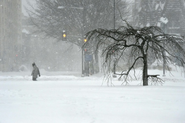 A man walks on snow covered Thomas Circle in Washington DC