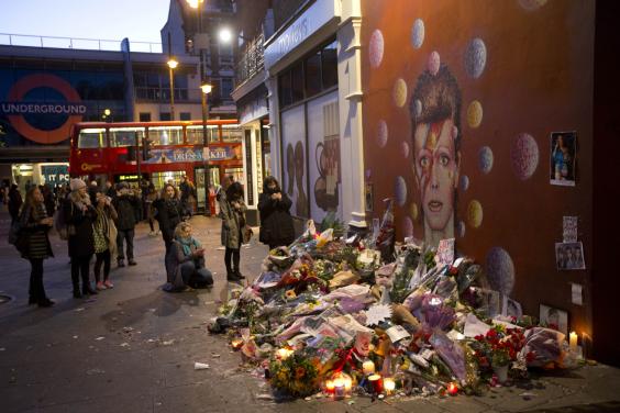 A sea of flowers at the mural of David Bowie in Brixton